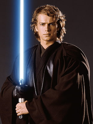 Anakin Skywalker in Jedi Robes Holding a Blue Lightsaber Against a Dark Background HD phone wallpaper