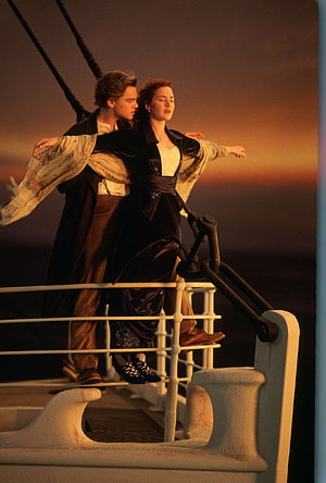 Titanic Movie Scene of Jack and Rose Dancing on the Bow at Sunset HD phone wallpaper