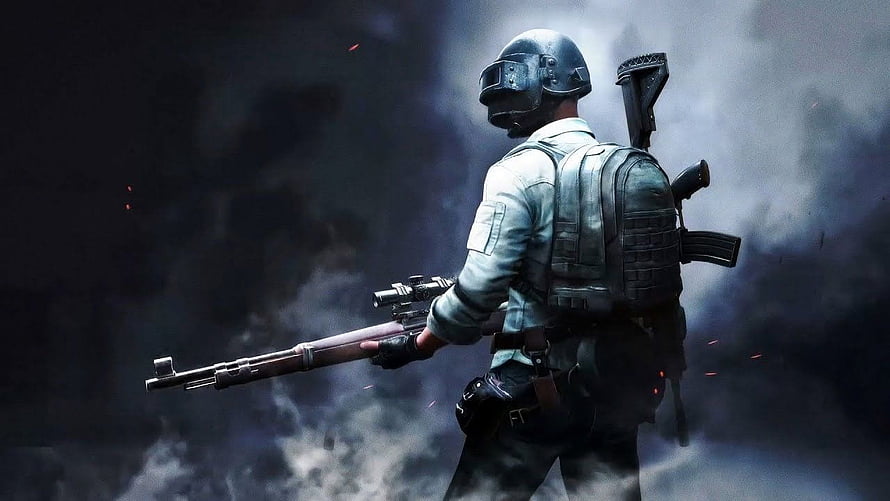 PUBG Mobile Soldier in Tactical Gear Holding Rifle Amidst Battlefield Smoke HD wallpaper