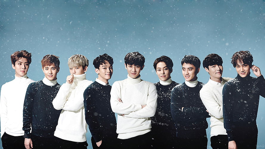 EXO Group Photo in Black and White Turtlenecks Against Snowy Blue Sky HD wallpaper