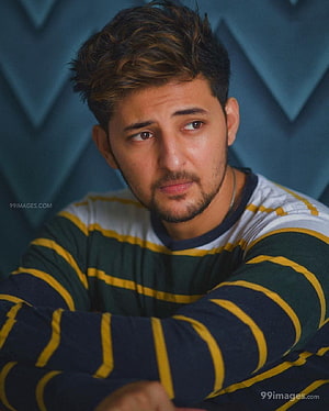 Darshan Raval Portrait in Striped Shirt Against Geometric Blue Background HD phone wallpaper
