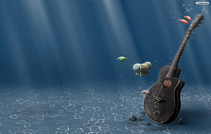 Underwater Acoustic Guitar with Floating Fish and Light Rays HD wallpaper