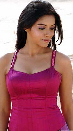 Asin Thottumkal in a vibrant magenta halter dress with a soft, natural expression HD phone wallpaper
