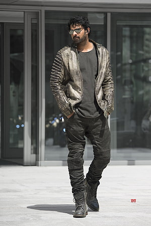 Prabhas in rugged leather jacket and tactical pants from the film Saaho HD phone wallpaper
