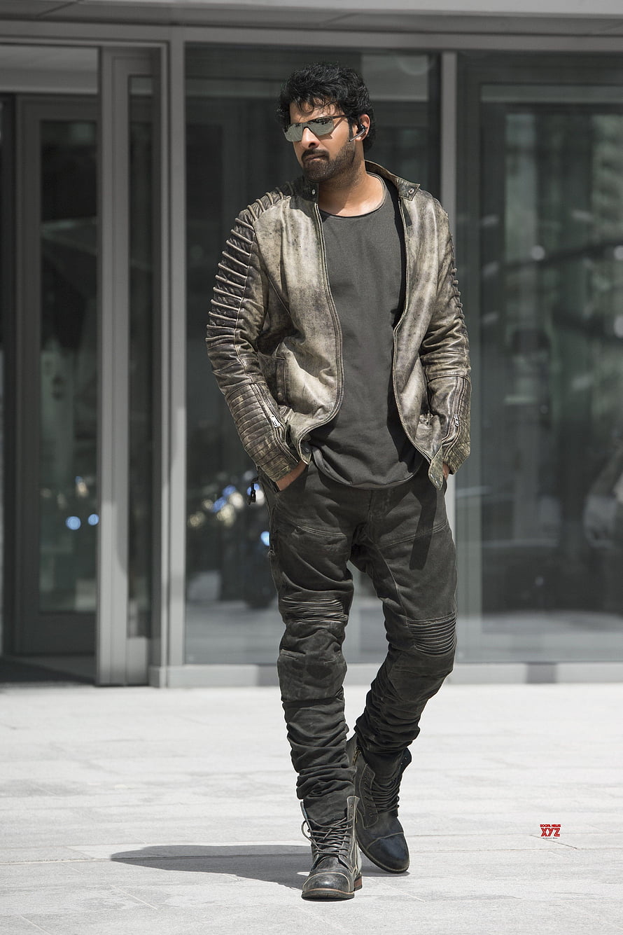 Prabhas in rugged leather jacket and tactical pants from the film Saaho HD phone wallpaper