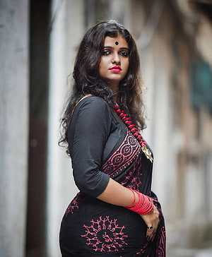 Elegant Woman in Black and Pink Saree with Traditional Bangles HD phone wallpaper