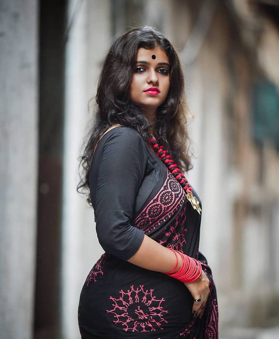 Elegant Woman in Black and Pink Saree with Traditional Bangles HD phone wallpaper