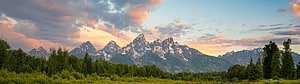 Grand Teton National Park Mountain Range at Sunset with Pine Forest and Dramatic Sky HD wallpaper