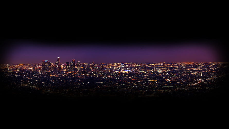 Panoramic Night Cityscape with Purple Skyline Glow and Distant Urban Lights HD wallpaper