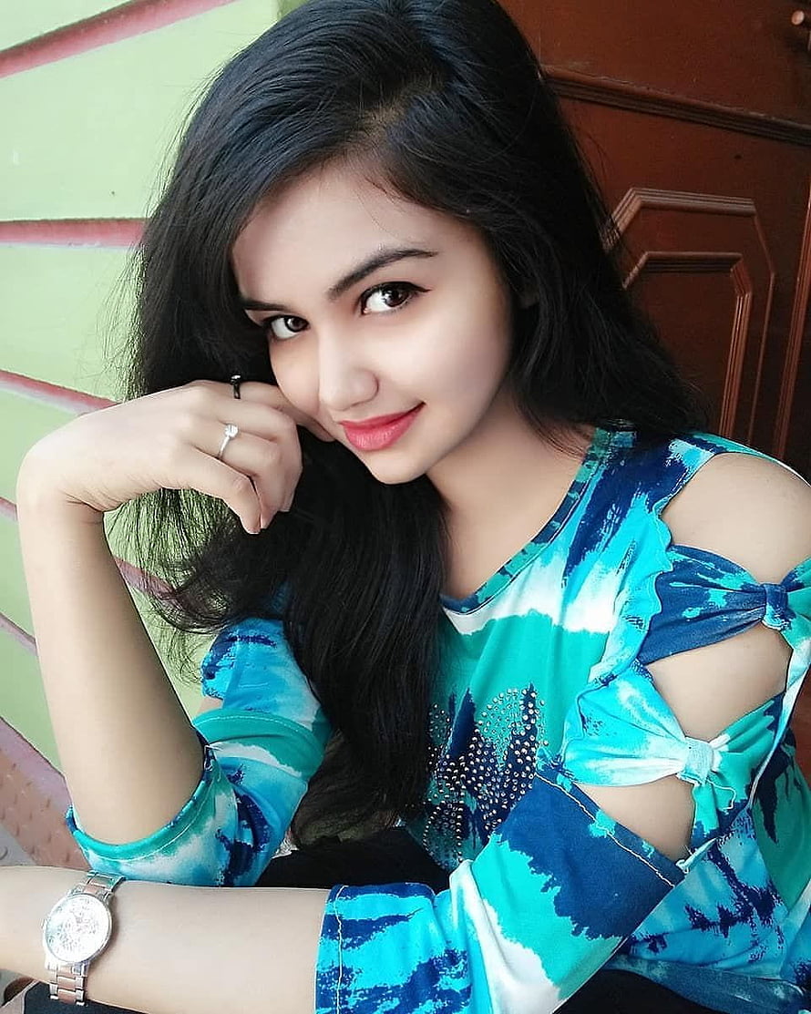 Young woman with long dark hair wearing a blue tie-dye top with cut-out sleeves HD phone wallpaper