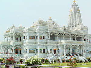 Vrindavan Prem Mandir White Marble Temple with Ornate Carvings and Garden Statues HD wallpaper