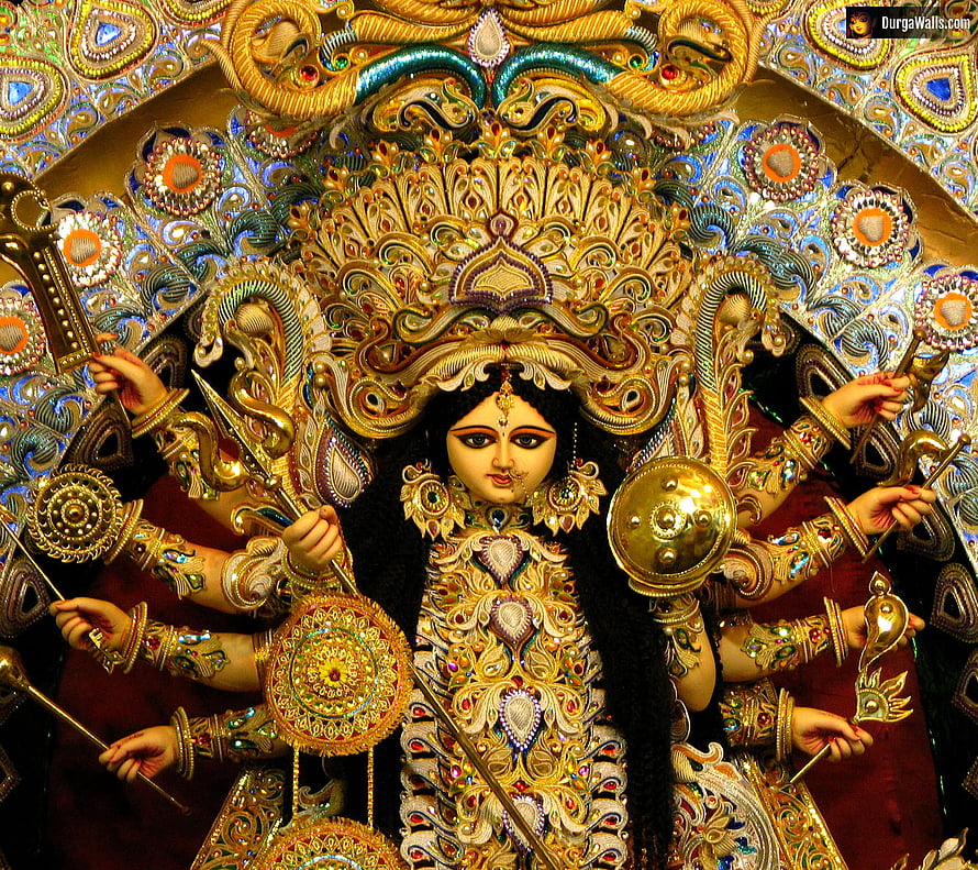 Ornate Durga Puja Idol with Multiple Arms and Golden Jewelry HD wallpaper