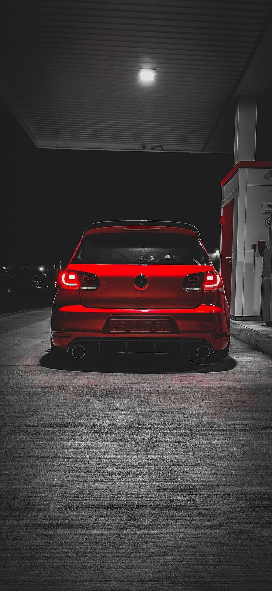 Rear View of a Red Volkswagen Golf GTI Parked at a Gas Station at Night HD phone wallpaper