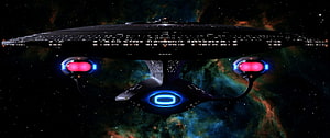 Star Trek Starship Enterprise Flying Through a Colorful Nebula in Deep Space HD wallpaper