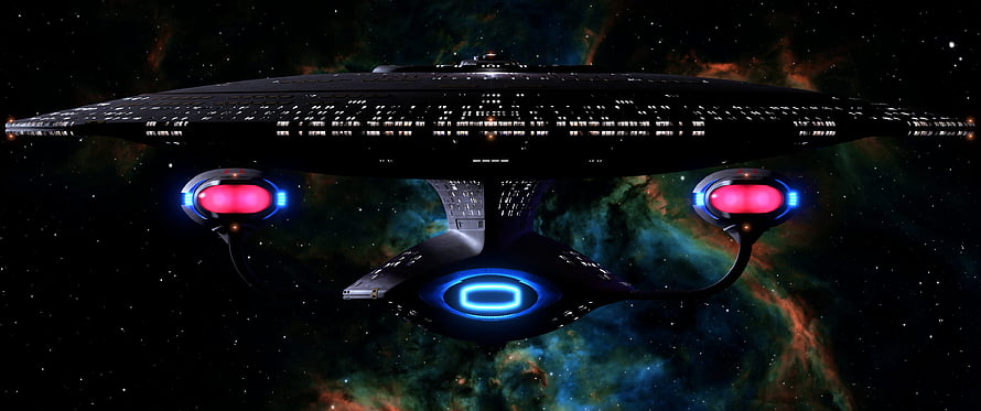 Star Trek Starship Enterprise Flying Through a Colorful Nebula in Deep Space HD wallpaper