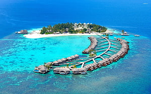 Aerial View of Luxury Overwater Bungalows on a Tropical Maldives Island Resort HD wallpaper