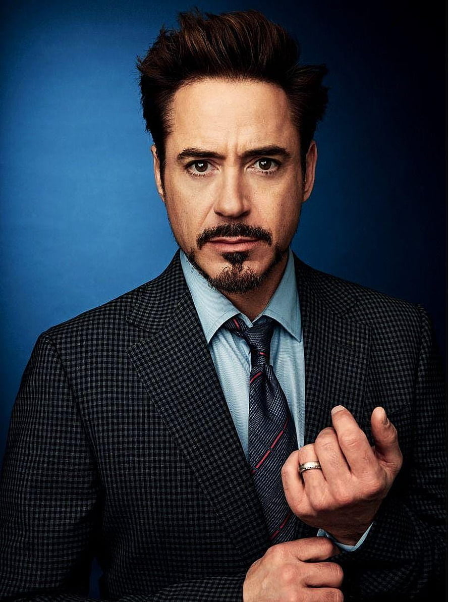 Robert Downey Jr. in a Checkered Suit and Striped Tie Against a Blue Background HD phone wallpaper