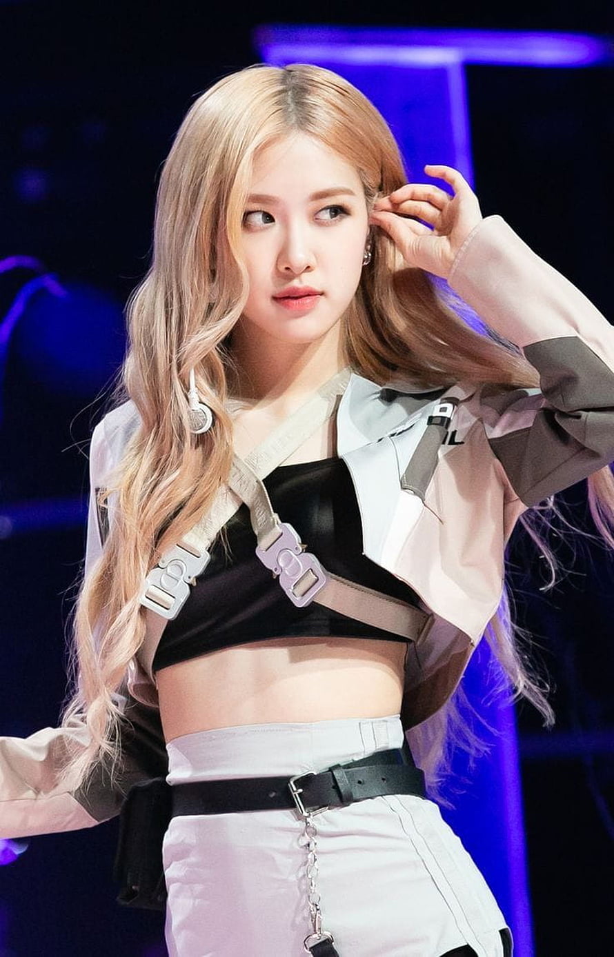 Rose from Blackpink performing on stage in a futuristic harness outfit with blonde hair HD phone wallpaper