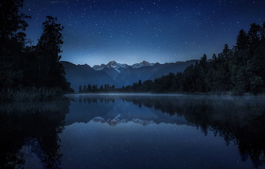 Lake Matheson at Night with Starry Sky and Mountain Reflections in New Zealand HD wallpaper