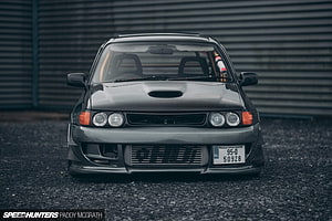 Front View of a Modified Toyota Starlet Turbo with Hood Scoop and Front Bumper HD wallpaper