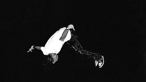 Playboi Carti Mid-Air Black and White Performance Shot HD wallpaper