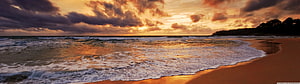 Golden Sunset Over Ocean Waves Lapping on Sandy Beach with Dramatic Clouds HD wallpaper