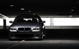 BMW E60 5 Series Sedan Front View in Dark Parking Garage HD wallpaper