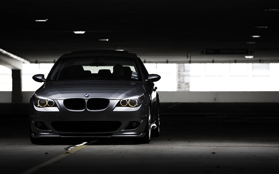 BMW E60 5 Series Sedan Front View in Dark Parking Garage HD wallpaper
