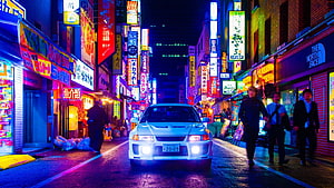 White JDM Car on Neon-Lit Tokyo Street at Night HD wallpaper