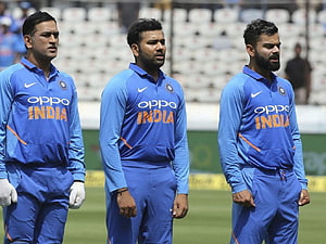 MS Dhoni, Virat Kohli, and Rohit Sharma in India Cricket Team Blue Jerseys HD wallpaper