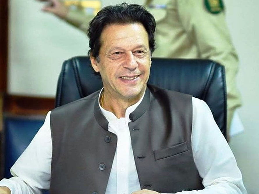 Imran Khan Seated in Formal Office Setting Wearing Traditional Attire HD wallpaper