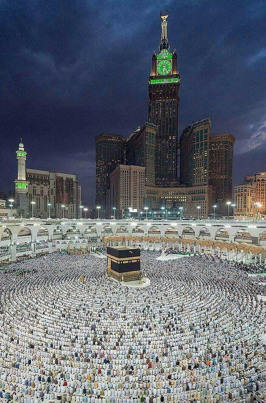 Massive Pilgrims Gather for Tawaf Around the Kaaba in Makkah at Night HD phone wallpaper