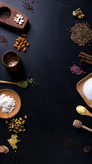 Dark Slate Food Ingredient Flat Lay with Nuts, Spices, and Grains HD phone wallpaper