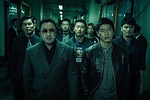 Don Lee in gritty Korean crime drama with gangsters in dim corridor HD wallpaper