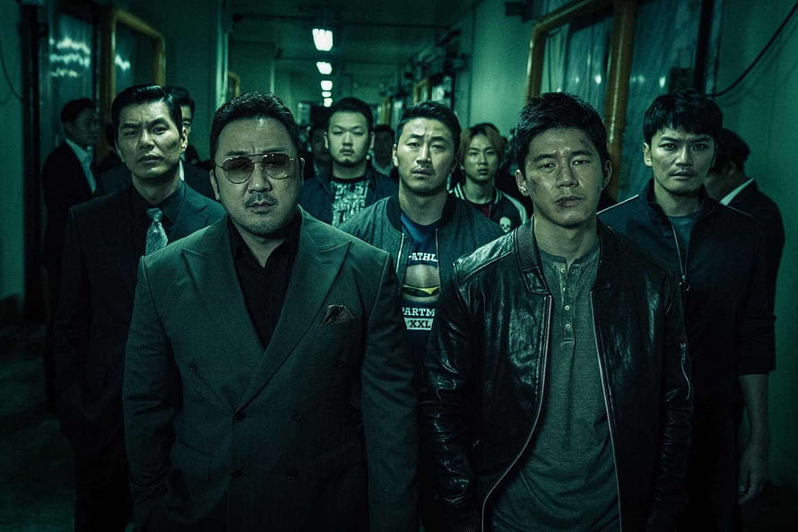 Don Lee in gritty Korean crime drama with gangsters in dim corridor HD wallpaper
