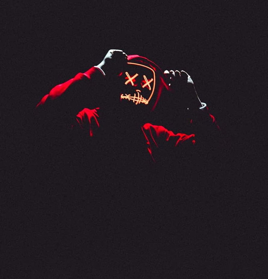 Slenderman Masked Figure in Red Suit Against Dark Background HD phone wallpaper