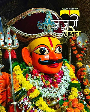 Jejuri Khandoba Deity Portrait With Marigold Garlands And Ornate Crown HD phone wallpaper