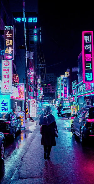 Lone Figure With Umbrella Walking Through Rainy Neon-Lit Korean Street at Night HD phone wallpaper