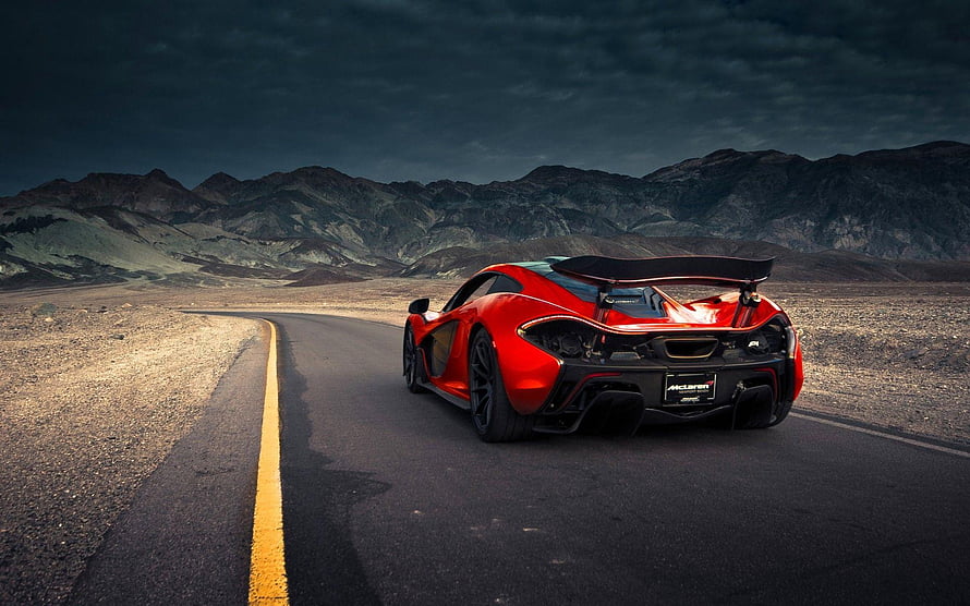 Red McLaren P1 Super Car on Desert Highway Under Dramatic Sky HD wallpaper