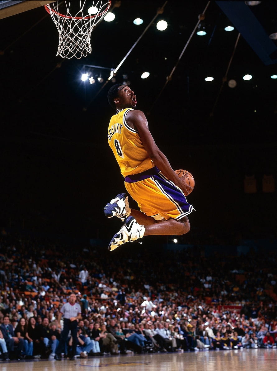 Kobe Bryant in a Golden Los Angeles Lakers Jersey Soaring for a Dunk HD phone wallpaper