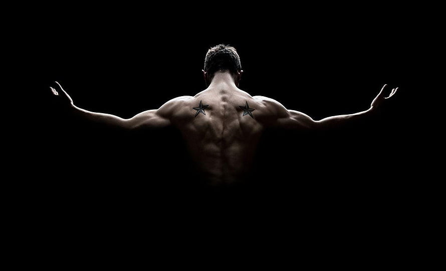 Muscular Male Back View With Star Tattoos Against Black Background HD wallpaper