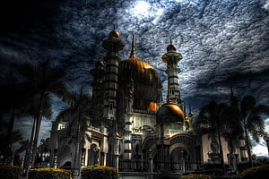 Grand Mosque with Golden Domes Under Dramatic Stormy Sky HD wallpaper