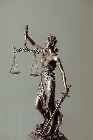 Bronze Lady Justice Statue Holding Scales and Sword on Pedestal HD phone wallpaper