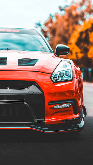 Nissan GT-R R35 Front End Close-Up with Aggressive Carbon Fiber Splitter and LED Headlights HD phone wallpaper
