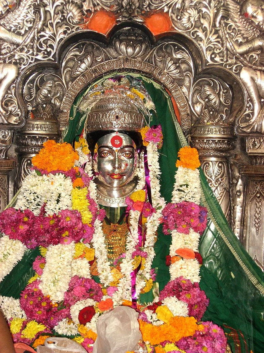 Ekwira Devi Silver Idol Adorned With Vibrant Flower Garlands In Temple Shrine HD phone wallpaper