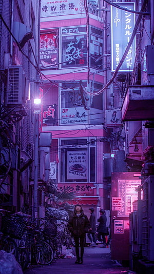 Neon-lit Japanese alleyway at night with pedestrians and dense urban signage HD phone wallpaper