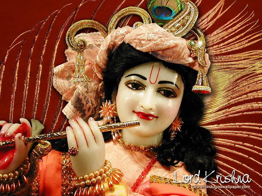 Lord Krishna Murti Playing Flute with Peacock Crown and Traditional Jewelry HD wallpaper