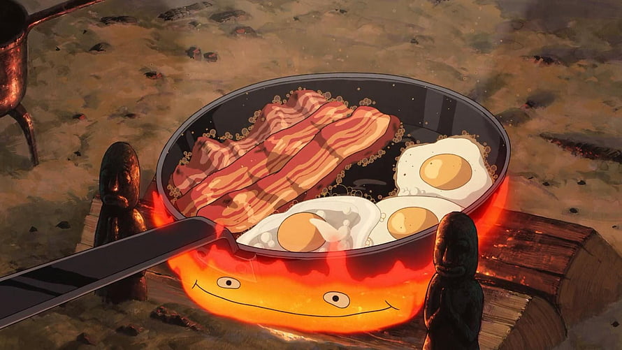 Calcifer Cooking Breakfast in a Frying Pan with Bacon and Eggs HD wallpaper