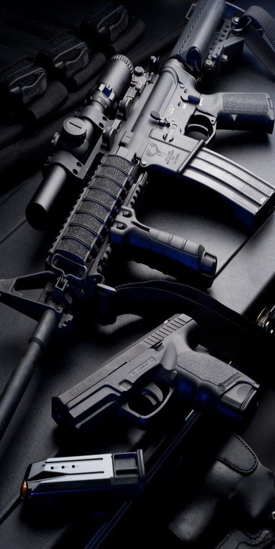 Tactical AR-15 Rifle and Glock Pistol Arrangement on Dark Surface HD phone wallpaper