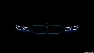BMW 330i M Sport Front Grille and Headlights Illuminated in Darkness HD wallpaper